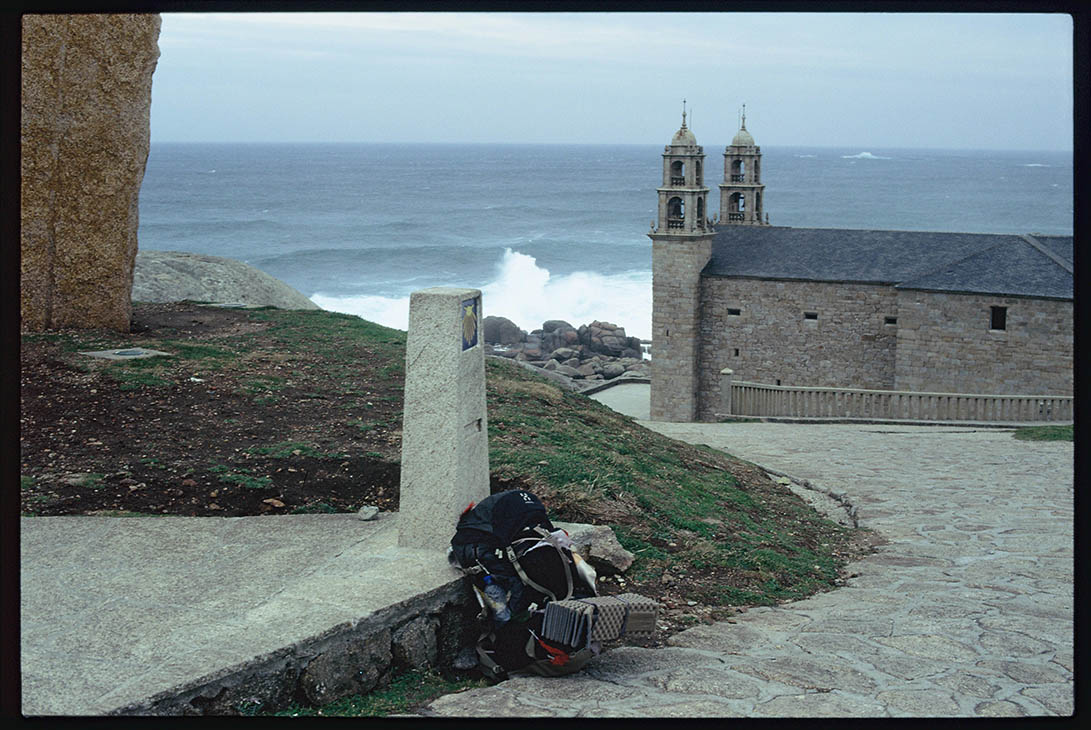 Church, sea and backpack in Muxia